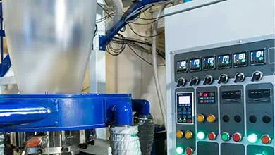 Industrial processing equipment with a digital control panel used to monitor and manage manufacturing operations.