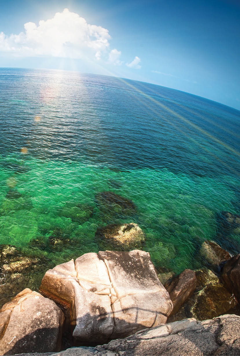 Seascape fisheye view on tropical sea with a huge stones  Vacation concept